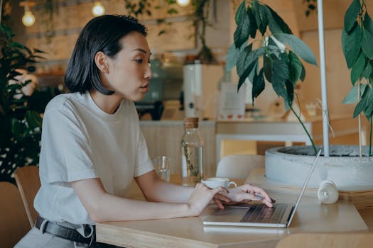 woman using financial app in a café