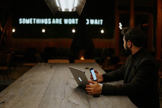 a digital nomad working on a laptop in a cozy café