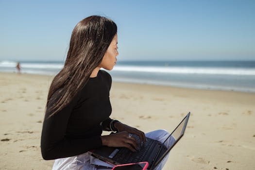 digital nomad working at a beach