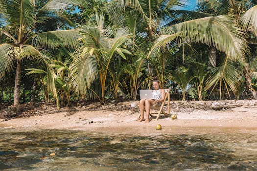 digital nomad working from a beach